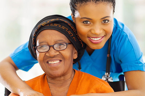 Nurse with woman in wheel chair