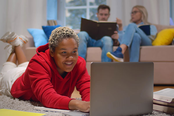 Group of people in living room studying